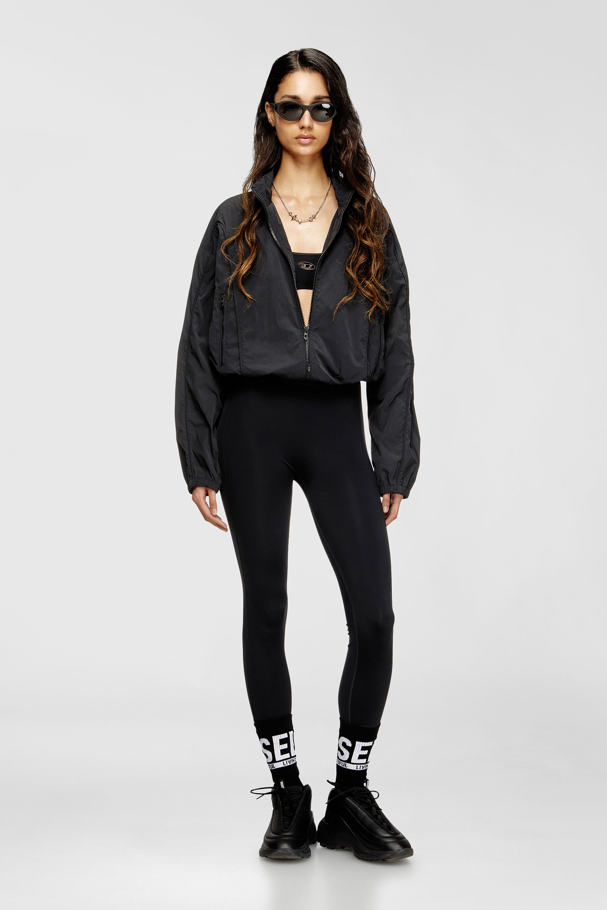 Diesel - MEREDITH-UTLT, Woman's Nylon leggings with cut-out back Oval D in Black - 6